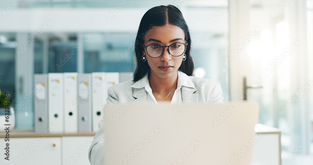 Business woman, glasses and working on laptop in office for planning, reading email and internet res