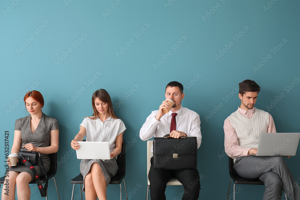 Young applicants waiting for job interview in room