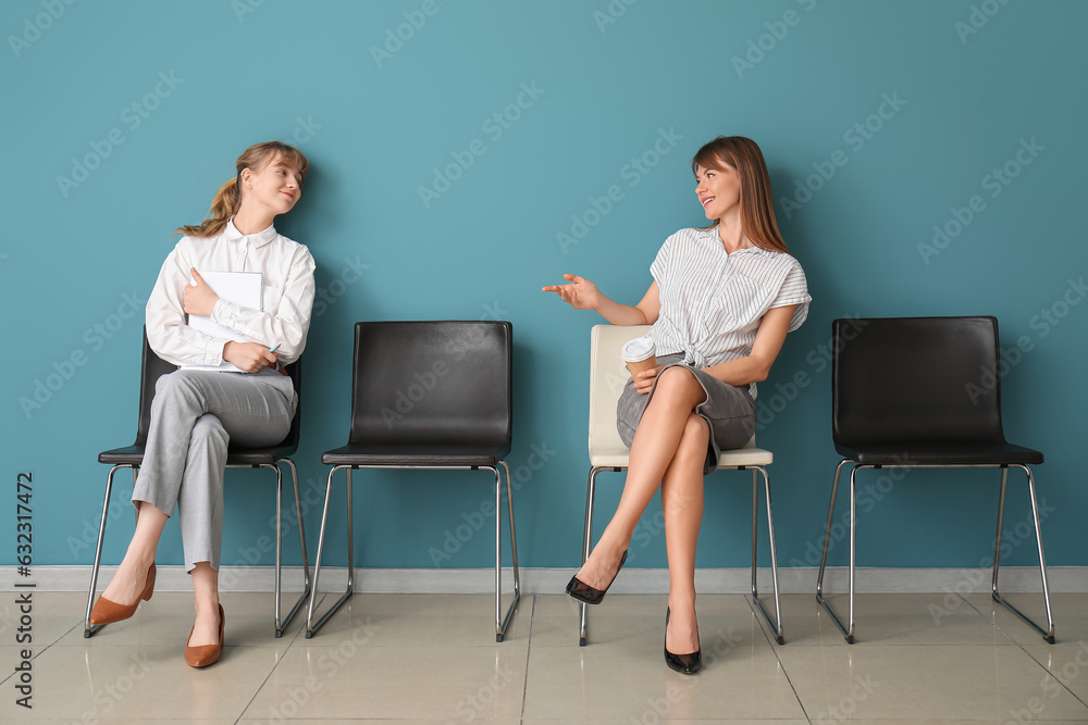 Female applicants waiting for job interview in room