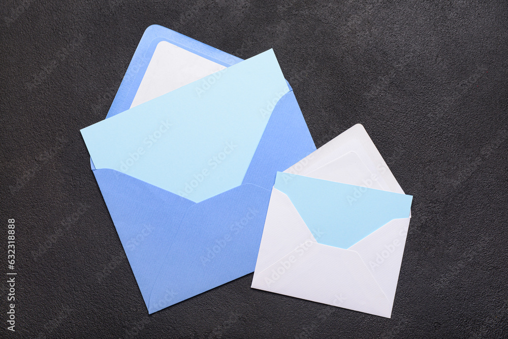 Envelopes with blank cards on dark background