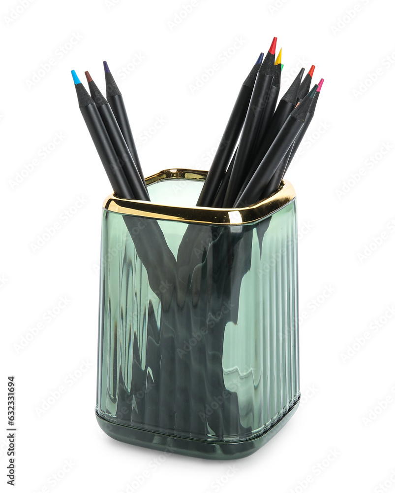 Glass holder with color pencils on white background