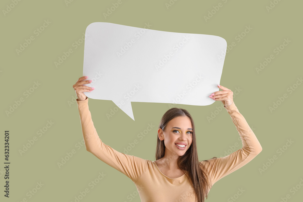 Beautiful happy young woman with speech bubble on green background