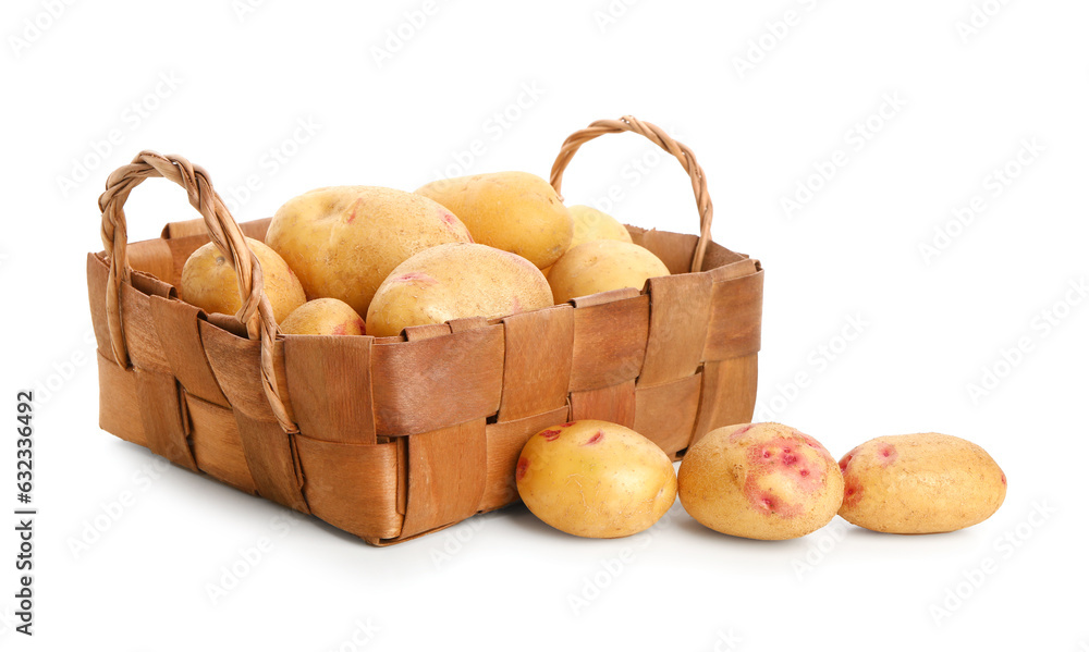 Wicker basket with fresh raw potatoes on white background