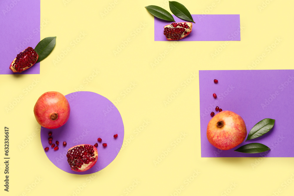 Fresh pomegranates and seeds on colorful background