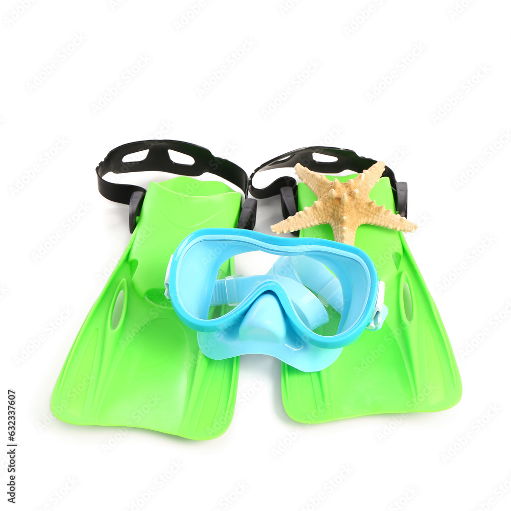 New swimming mask, starfish and flippers on white background