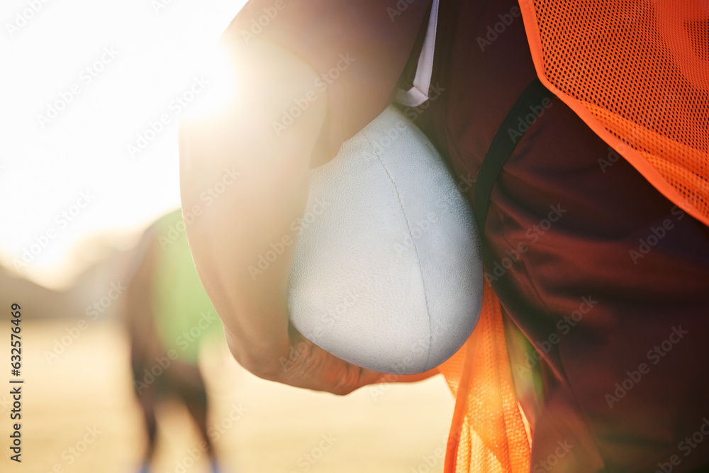 Rugby, sports and hands on ball in exercise, workout or training outdoor at field lens flare. Americ