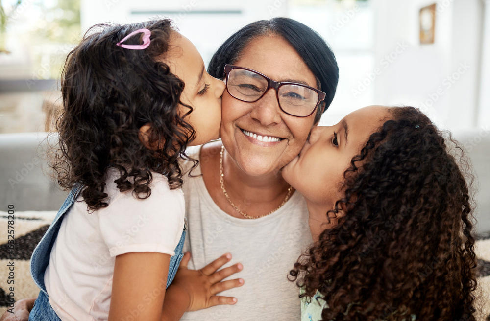 Children kissing their grandmother on her cheek with love, care and happiness in the living room. Ha