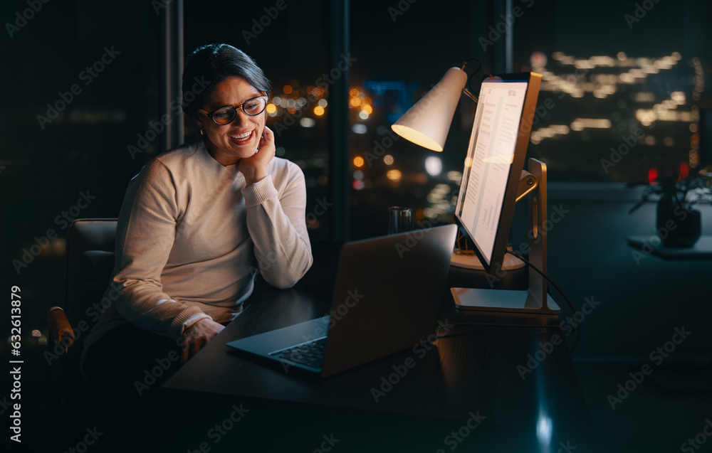 Happy female entrepreneur having a virtual business meeting at night