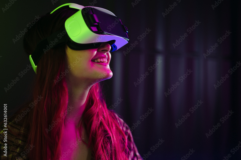 Going on a virtual adventure: Happy young woman wearing a vr headset