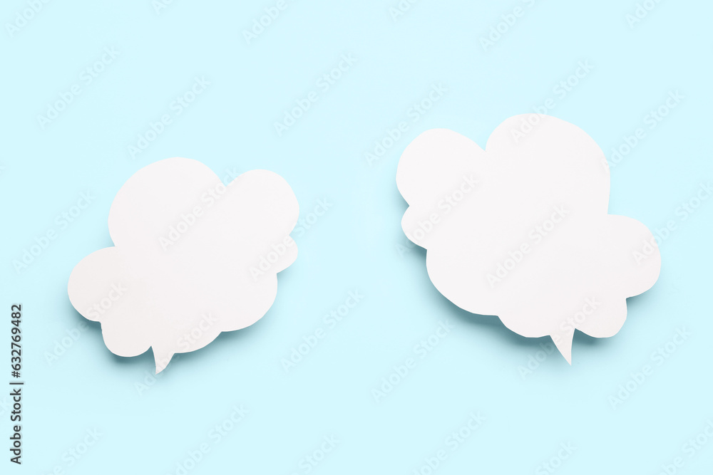 Empty speech bubbles on blue background