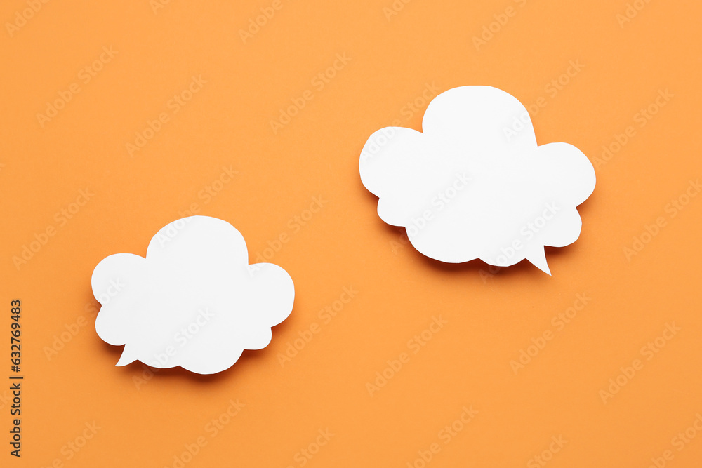 Empty speech bubbles on orange background