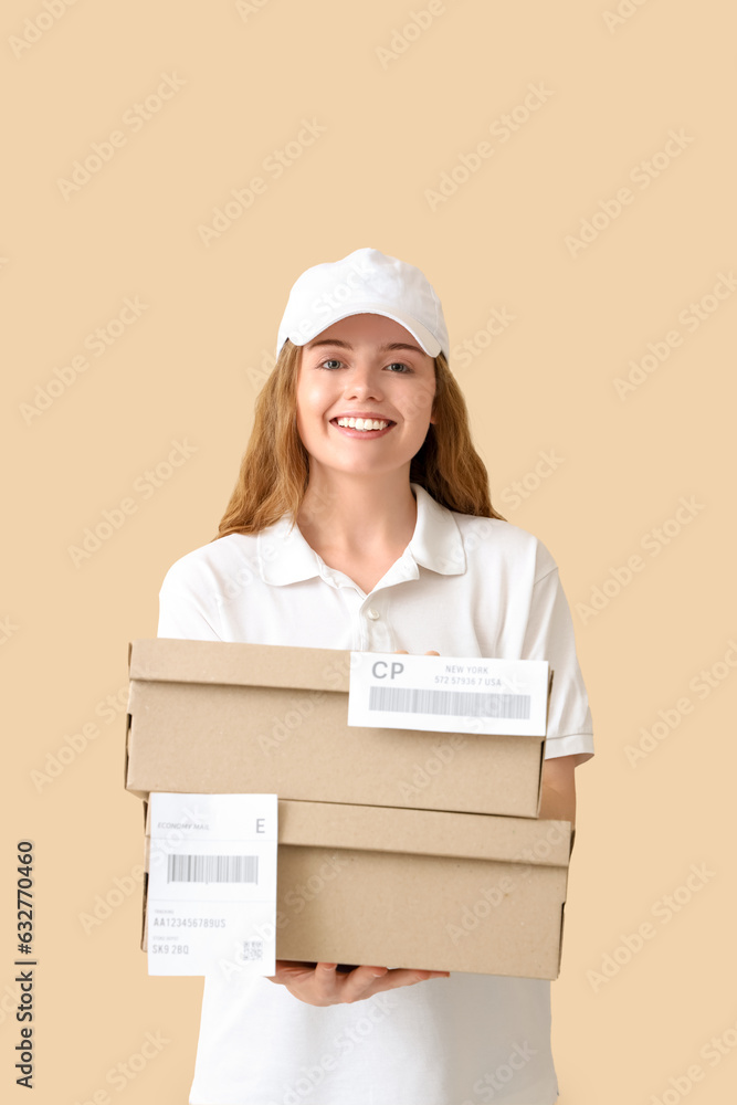 Female courier with parcels on beige background