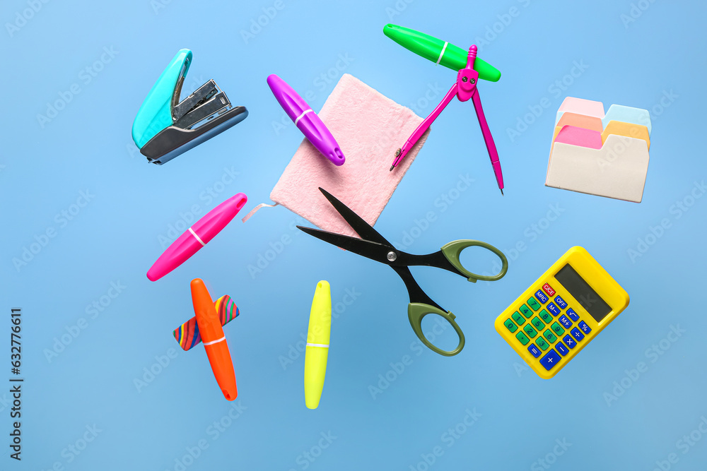 Different school supplies flying against color background