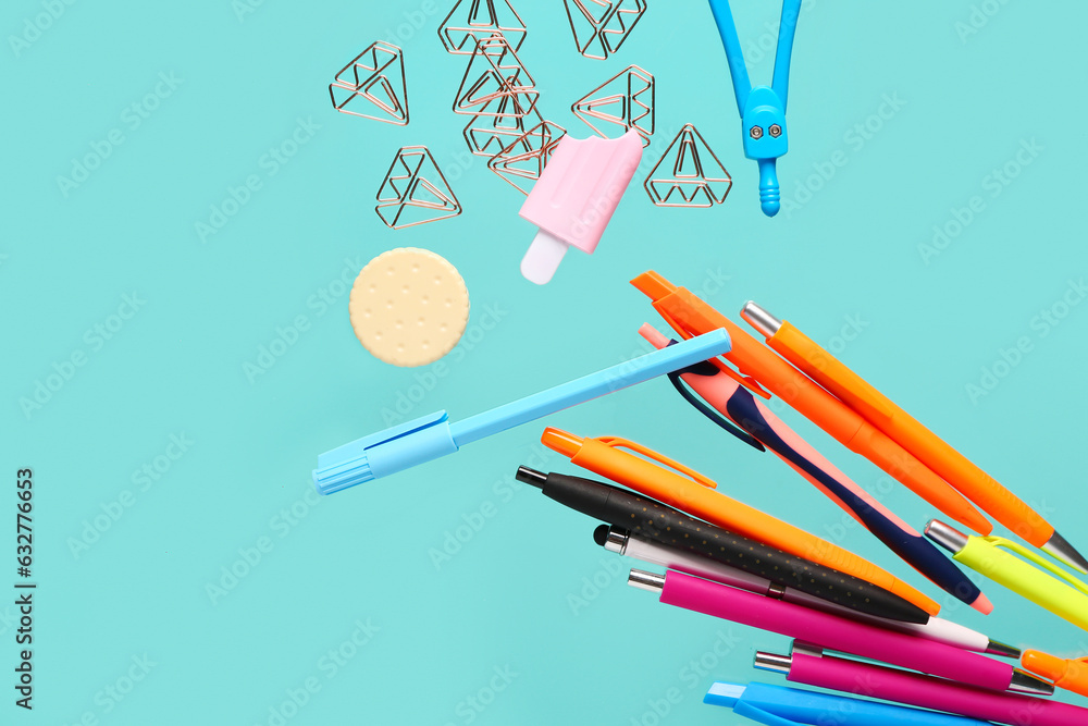 Different colorful stationery flying on color background