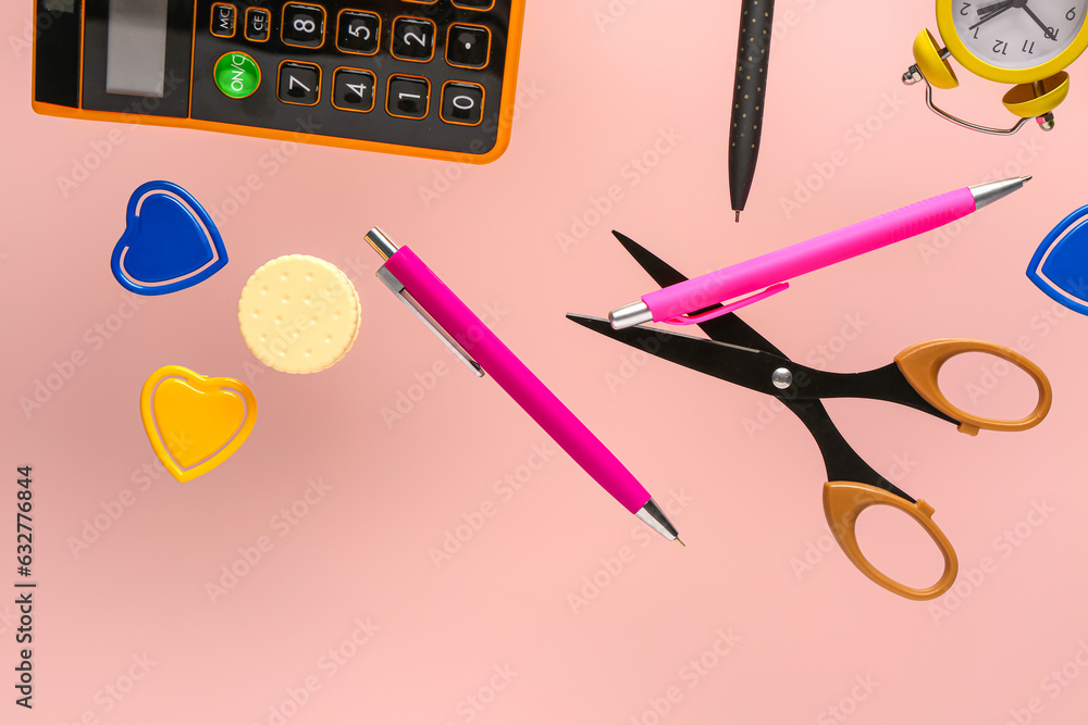 Flying stationery on pink background