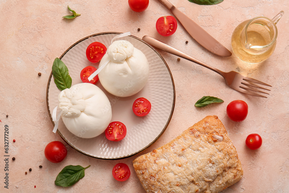 Plate with tasty Burrata cheese on beige background