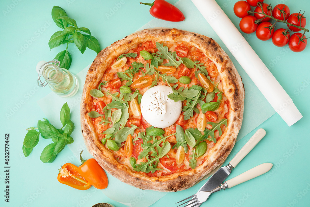 Tasty pizza with Burrata cheese on green background