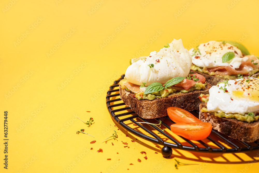 Grid of tasty sandwiches with egg on yellow background