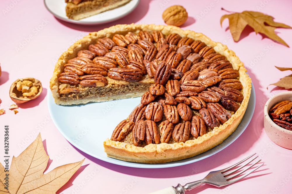 Tasty pecan pie on pink background