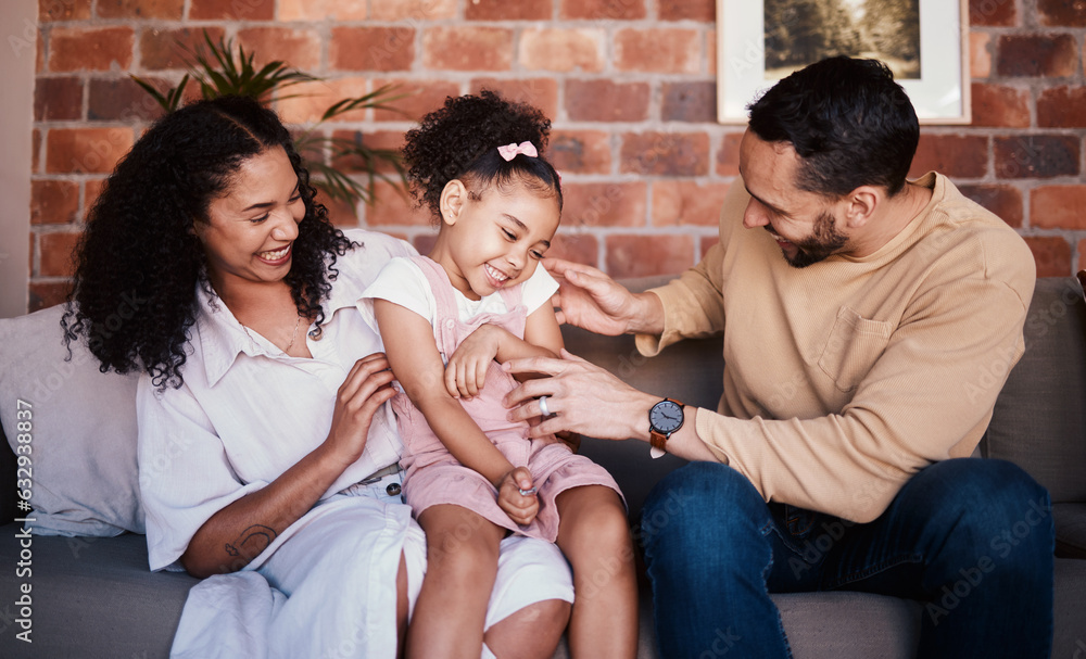 Family, tickle and laughing while playing on a home sofa for fun, bonding and time together. A happy