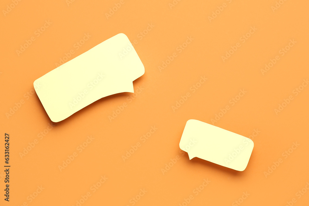 Empty speech bubbles on orange background