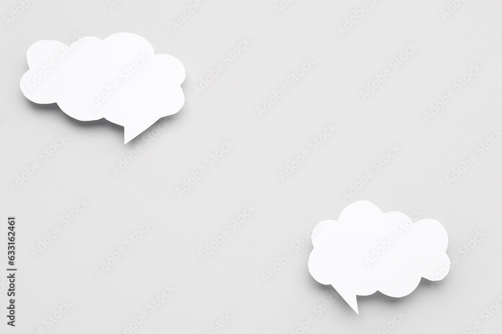 Blank speech bubbles on grey background