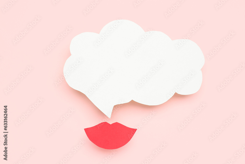 Paper lips with blank speech bubble on pink background