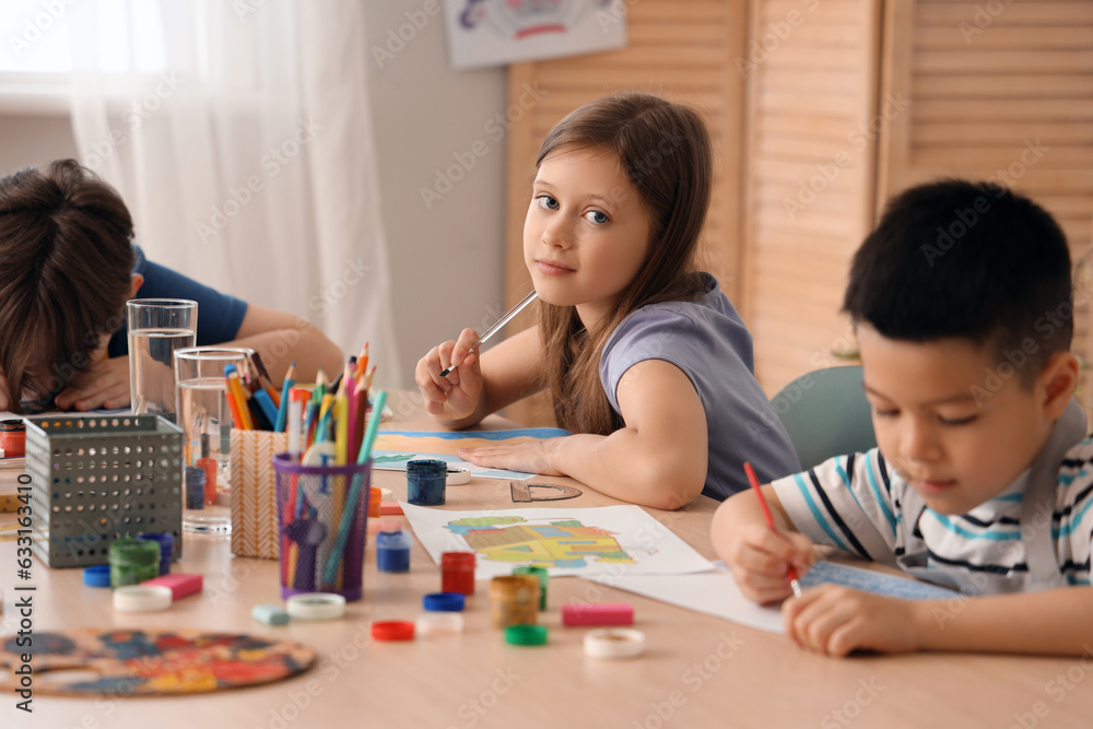 Little girl drawing in art class