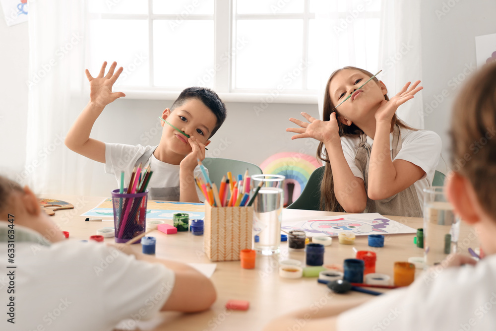 Little pupils having fun in art class