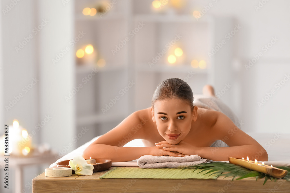 Pretty young woman in spa salon