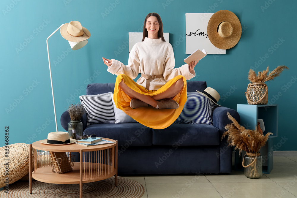 Interior of cozy living room with blue sofa and coffee table