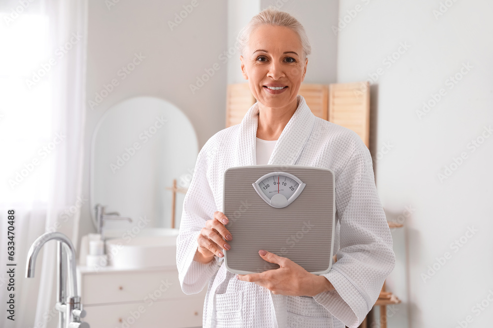 Mature woman with scales in bathroom