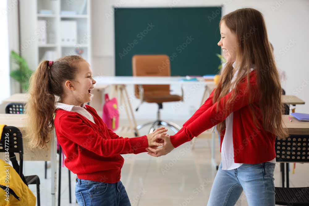 Happy little girls in classroom