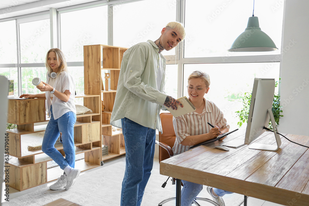 Team of graphic designers working in office