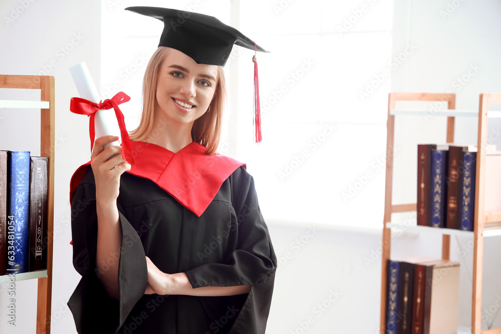 Female graduate student with diploma in library