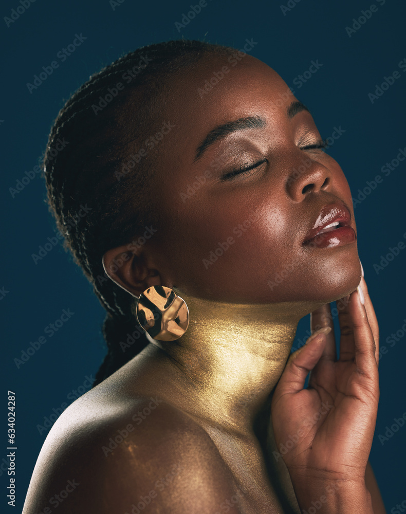 Beauty, gold and makeup with face of black woman for creative, luxury and cosmetics. Glow, glamour a