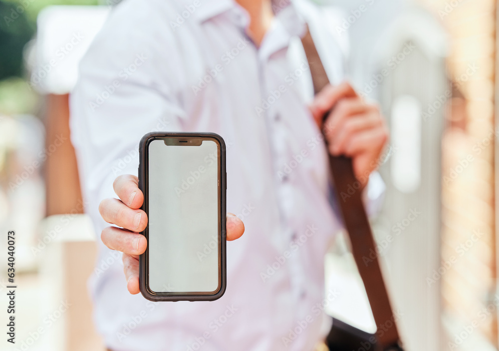 Hand, phone and mockup with a business man in the city on his morning commute into work closeup. Mob