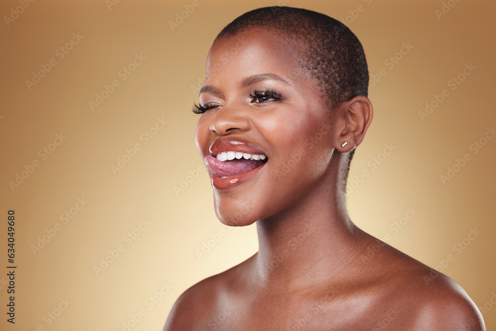 Makeup, tongue out and black woman wink in studio for cosmetic wellness on brown background space. B