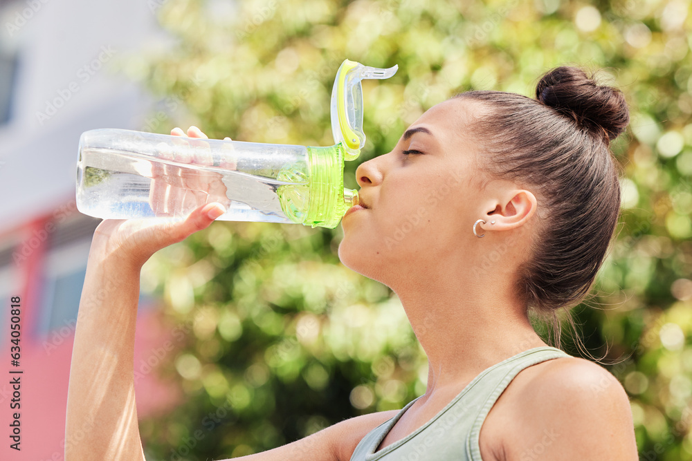 Woman, fitness and drinking water in nature for sustainability after workout, training or outdoor ex