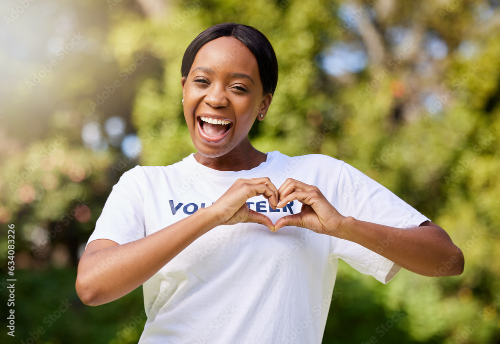 Heart, hands and portrait of volunteer woman with sign for care, support and charity outdoor in natu