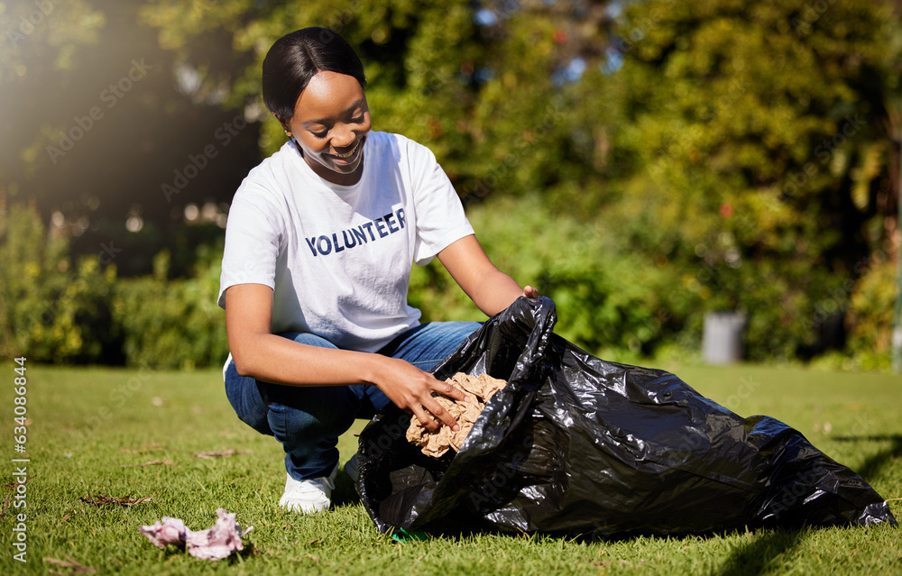 Volunteer, woman and cleaning waste in park for community service, pollution and climate change or e