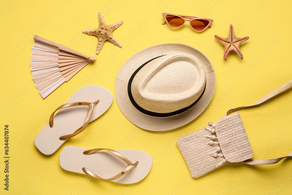 Composition with stylish beach accessories and starfishes on color background