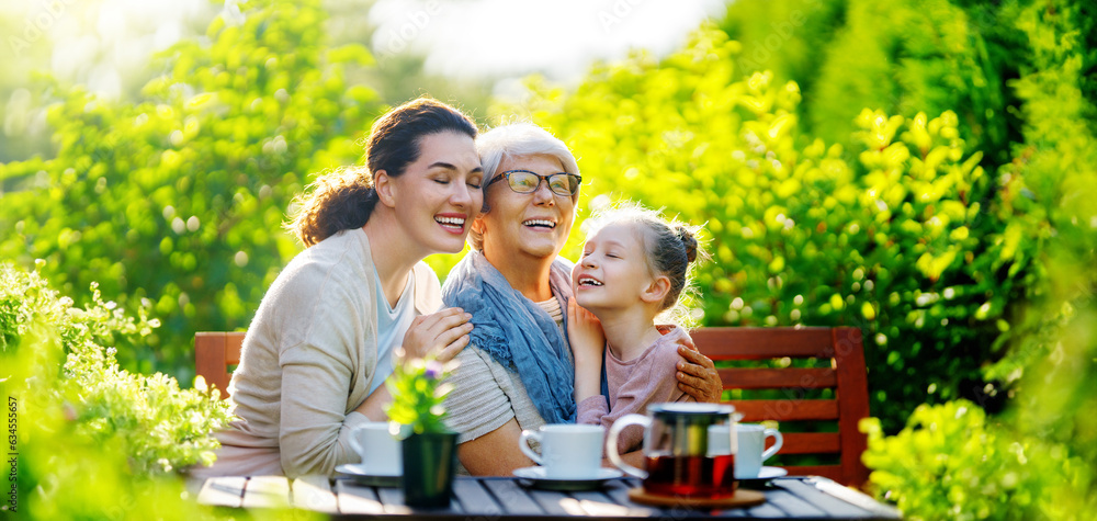 family drinking tea in the garden