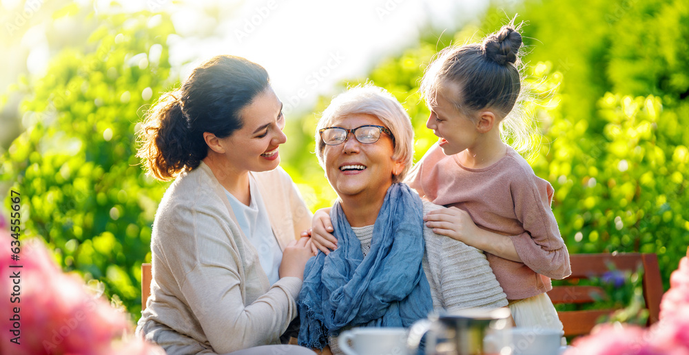 family drinking tea in the garden