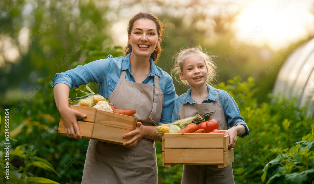 mother and daughter gardening in the backyard