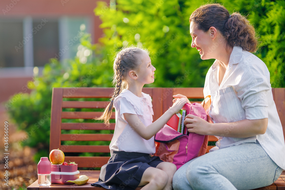 Parent and kid going to school