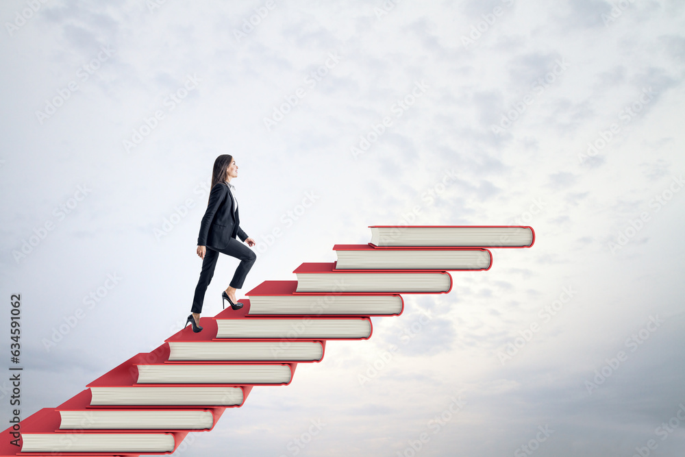 Side view of young businesswoman climbing red book steps. Cloudy sky background with mock up place. 