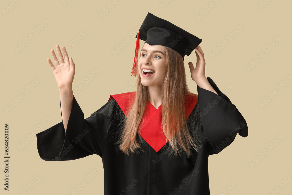 Female graduate student on beige background