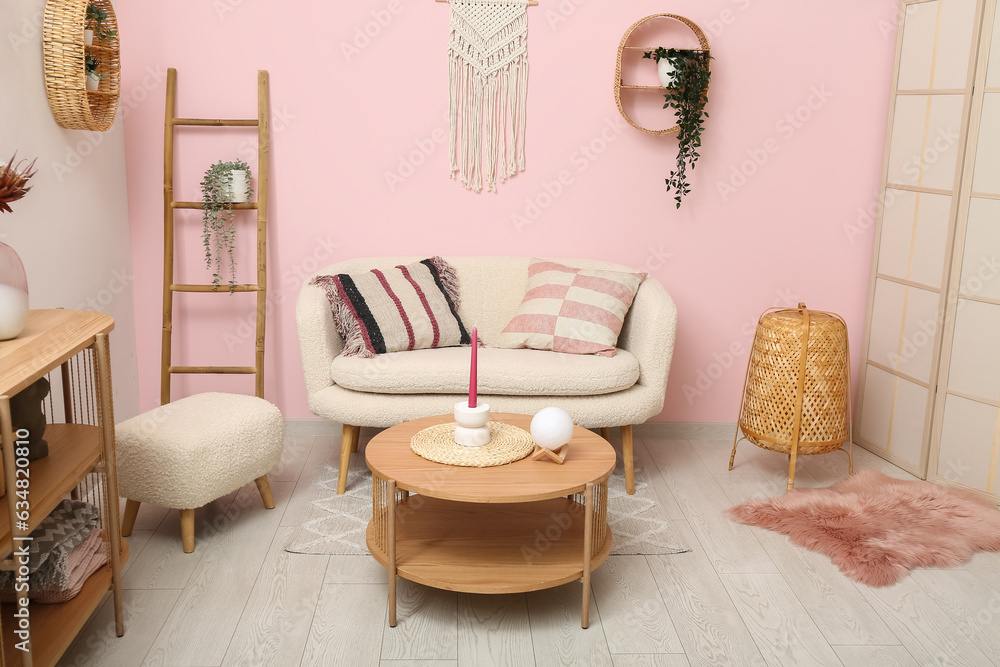 Living room interior with white sofa, coffee table and ottoman