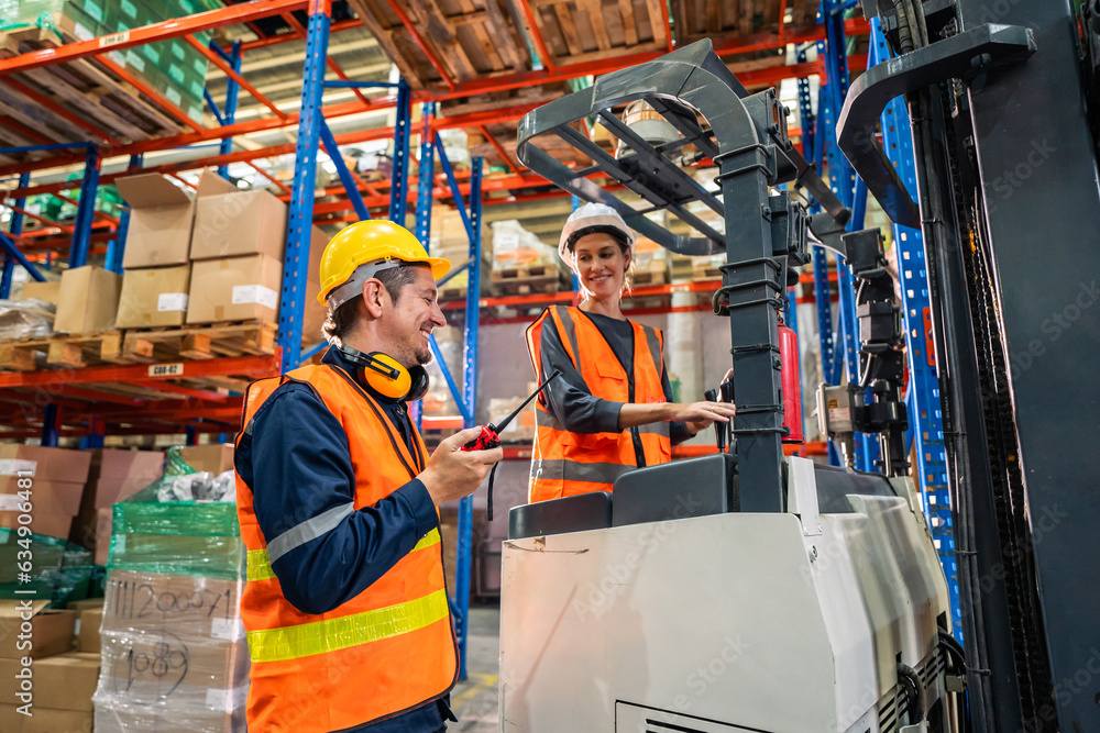 Caucasian man and woman industrial worker work in manufacturing plant. 